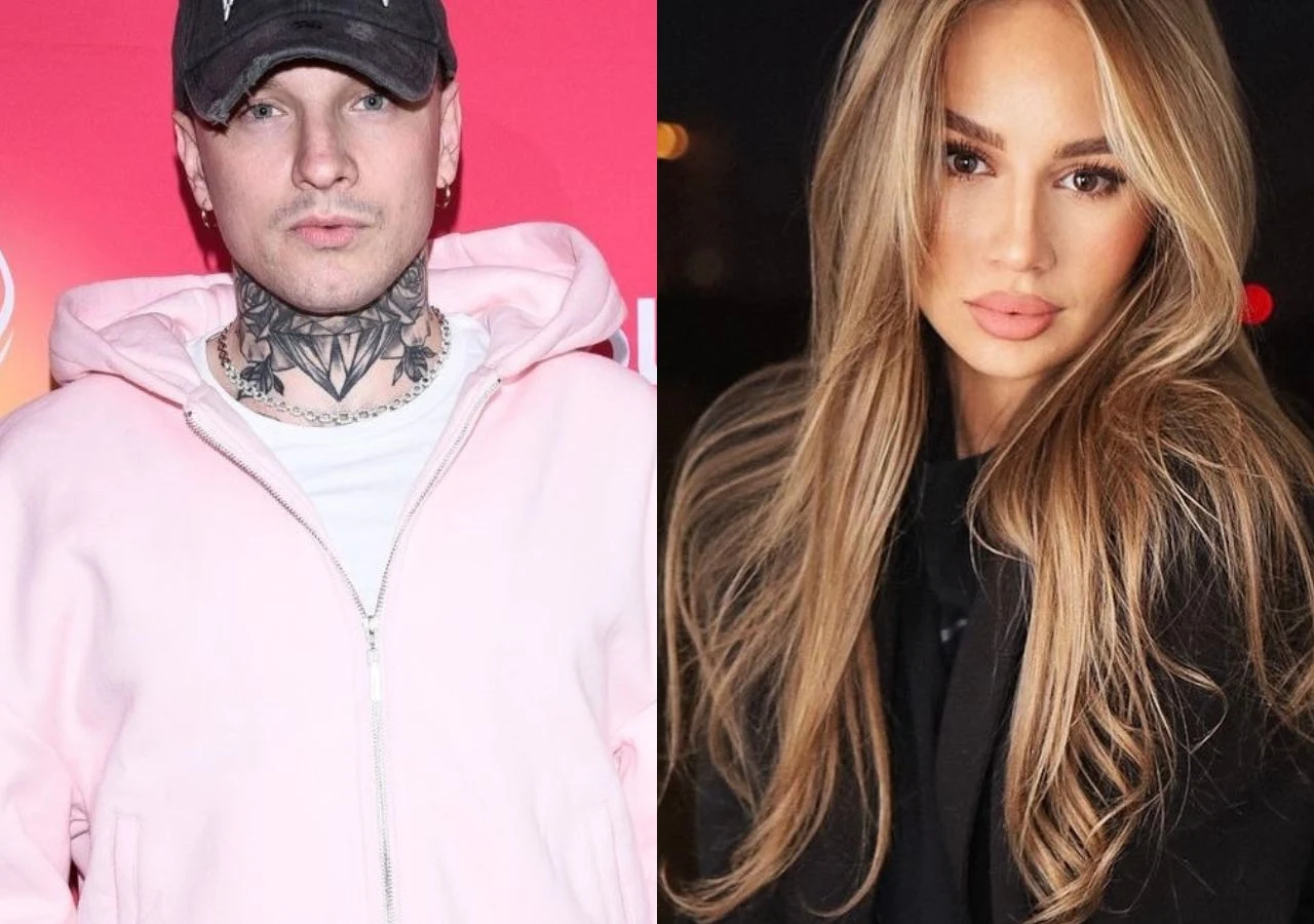 Smolasty i Imi wystąpią na Sylwestrze Polsatu Dwoje młodych ludzi; po lewej mężczyzna w jasnoróżowej bluzie z kapturem, czapce z daszkiem oraz z widocznymi tatuażami na szyi, na tle czerwonej ścianki, po prawej kobieta z długimi blond włosami i makijażem, ubrana na czarno, tle ciemne.