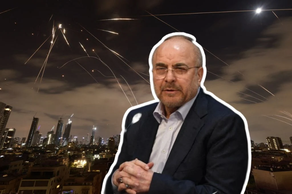 Iran grozi USA i Izraelowi. Mówi o "uzasadnionych celach" uderzenia Mężczyzna w garniturze i okularach na tle nocnego miasta, nad którym widoczne są smugi świateł sugerujące atak rakietowy lub działania wojenne.