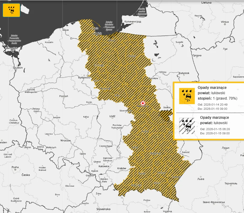 Mapa Polski z zaznaczoną na żółto strefą zagrożenia związanej z opadami marznącymi, obejmująca centralną i wschodnią część kraju. Po prawej stronie widoczne jest ostrzeżenie meteorologiczne dotyczące powiatu łukowskiego z informacją o czasie trwania za...