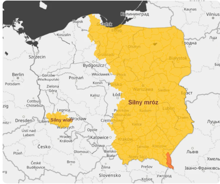 Mapa Polski z zaznaczonymi strefami ostrzeżeń meteorologicznych, gdzie wschodnia część kraju objęta jest ostrzeżeniem przed silnym mrozem, a rejon przy granicy czeskiej ostrzeżeniem przed silnym wiatrem.