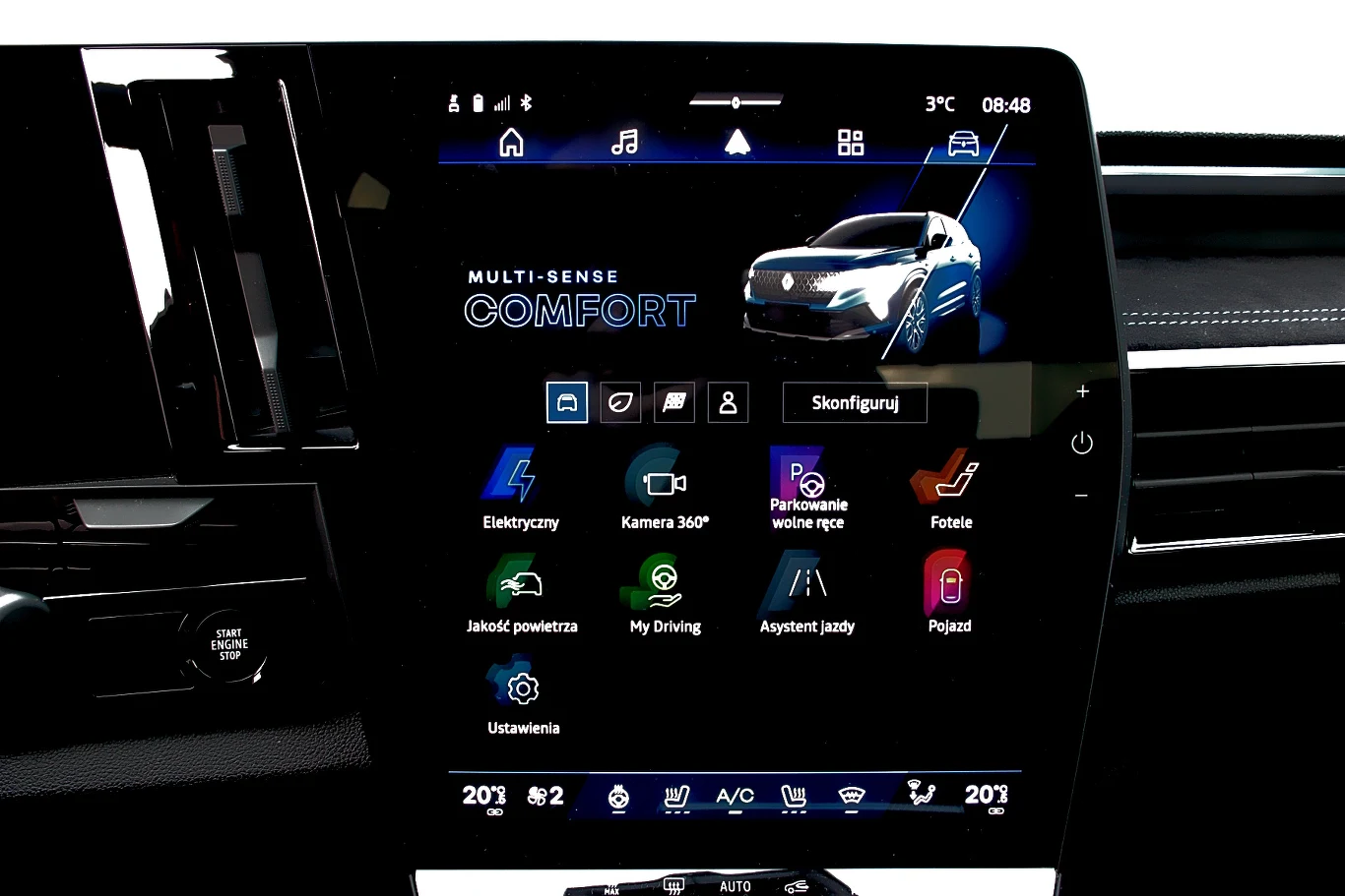 Duży ekran dotykowy systemu multimedialnego w nowoczesnym samochodzie z wyświetlonymi ikonami funkcji, takich jak tryby jazdy, parkowanie, kamera 360°, klimatyzacja i asystent jazdy.