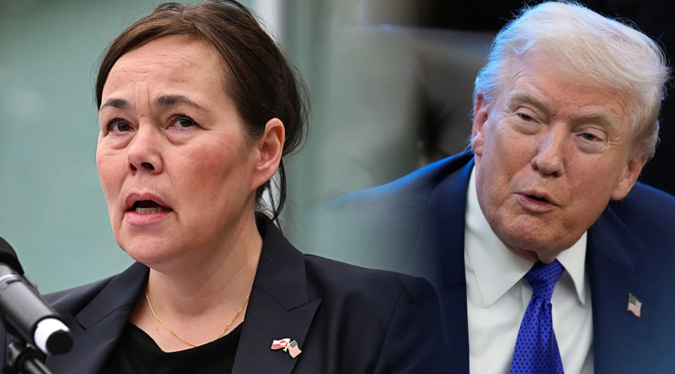 Kobieta z ciemnymi włosami w ciemnym garniturze mówi przy mikrofonie, obok mężczyzna w garniturze i niebieskim krawacie patrzy w jej kierunku, oboje mają poważny wyraz twarzy.