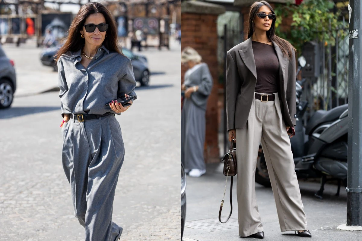 Low energy dressing w praktyce. Fot. Valentina Frugiuele, Christian Vierig Dwie kobiety ubrane w modne, eleganckie stylizacje na ulicy miasta. Jedna ma na sobie szarą koszulę i spodnie z wysokim stanem, druga ciemną marynarkę i jasne szerokie spodnie. Obie noszą okulary przeciwsłoneczne i dodatki w postaci pasków i torebek.