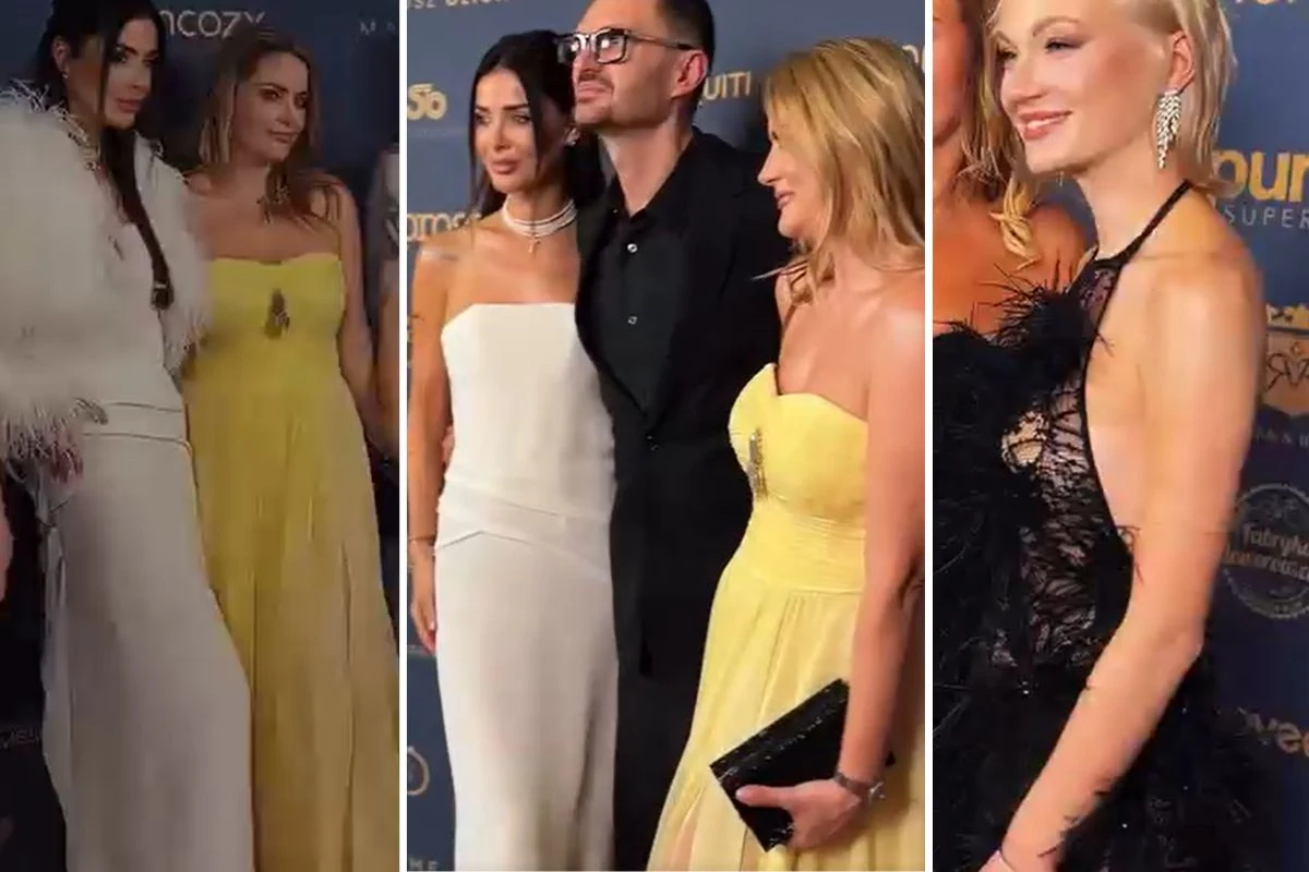 Kreacje Macieja Zienia cieszył się dużą popularnością na balu Grupa elegancko ubranych osób pozująca na tle ścianki z logotypami podczas uroczystego wydarzenia. Kobiety w efektownych wieczorowych sukniach, w tym białych i żółtych, jedna z pań z dużymi kolczykami. Mężczyzna w okularach ubrany w klasyczny czarny ga...