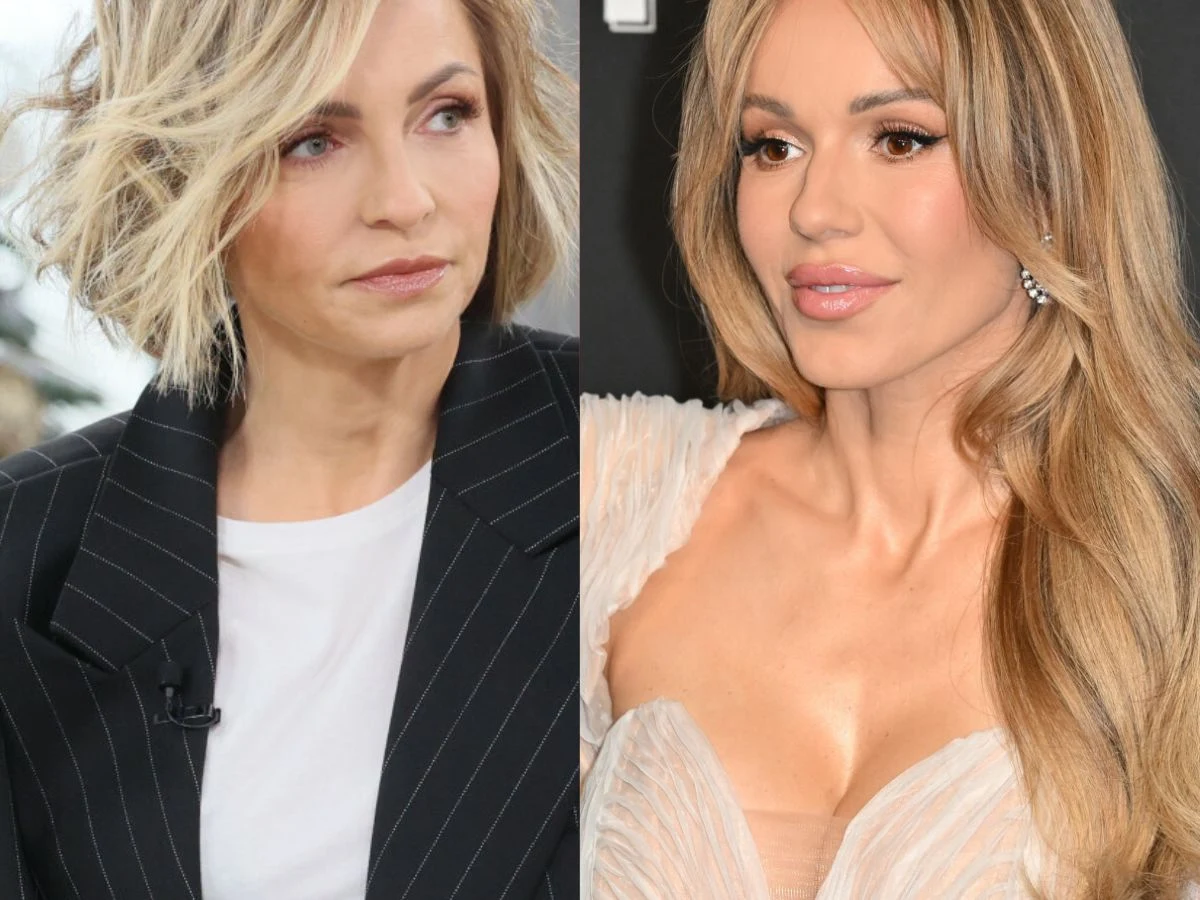 Anna Wyszkoni, Doda Dwie kobiety ukazane w zestawieniu, z lewej strony kobieta w eleganckim ciemnym garniturze i jasnej bluzce, z krótkimi, jasnymi włosami; z prawej strony kobieta w kremowej sukni z długimi, jasnymi włosami, na tle czarnej ścianki.