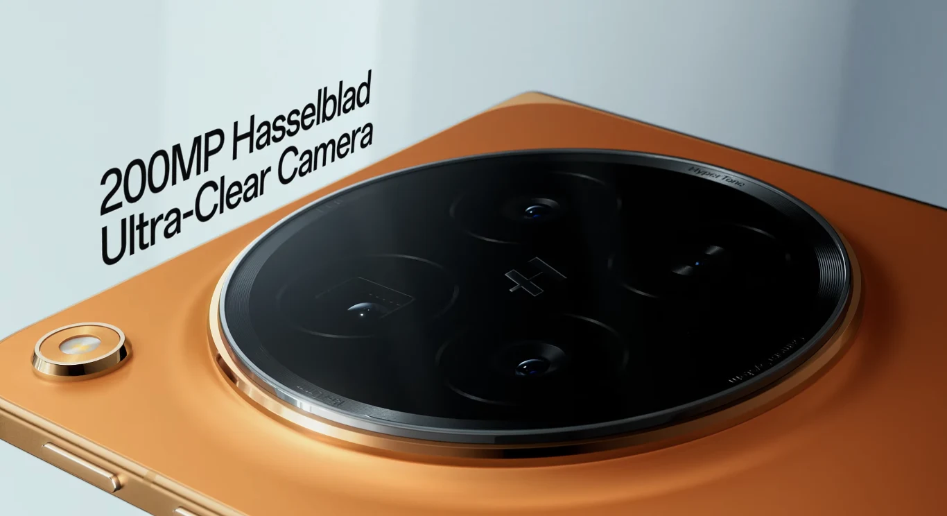 Aparat fotograficzny Oppo Find N6 wprowadza liczne udoskonalenia względem modelu N5. Duży okrągły moduł aparatu fotograficznego Hasselblad o rozdzielczości 200 MP na pomarańczowej obudowie smartfona, z wyeksponowanymi obiektywami i napisem Ultra-Clear Camera.