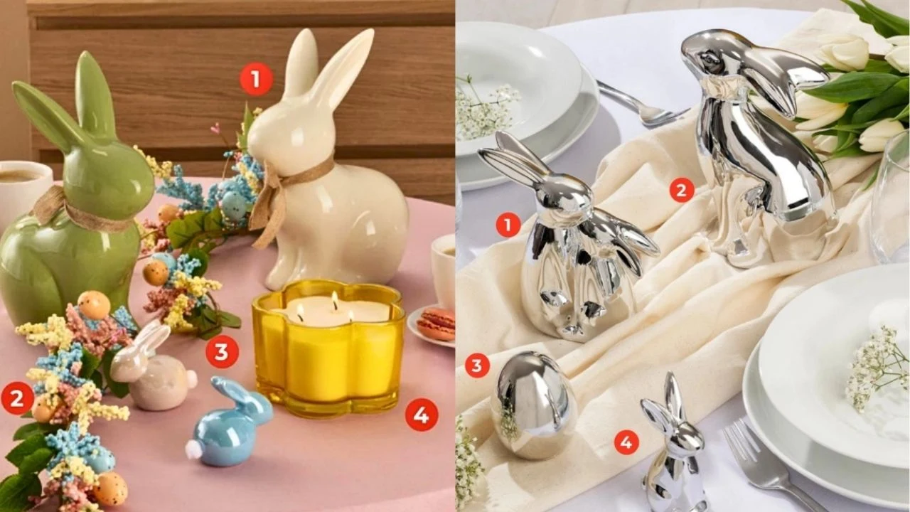 Kolorowe ceramiczne i metaliczne figurki królików ustawione na świątecznych stołach, otoczone dekoracyjnymi jajkami, kwiatami i żółtą świecą, na eleganckim, pastelowym tle z białą zastawą i delikatną roślinnością.