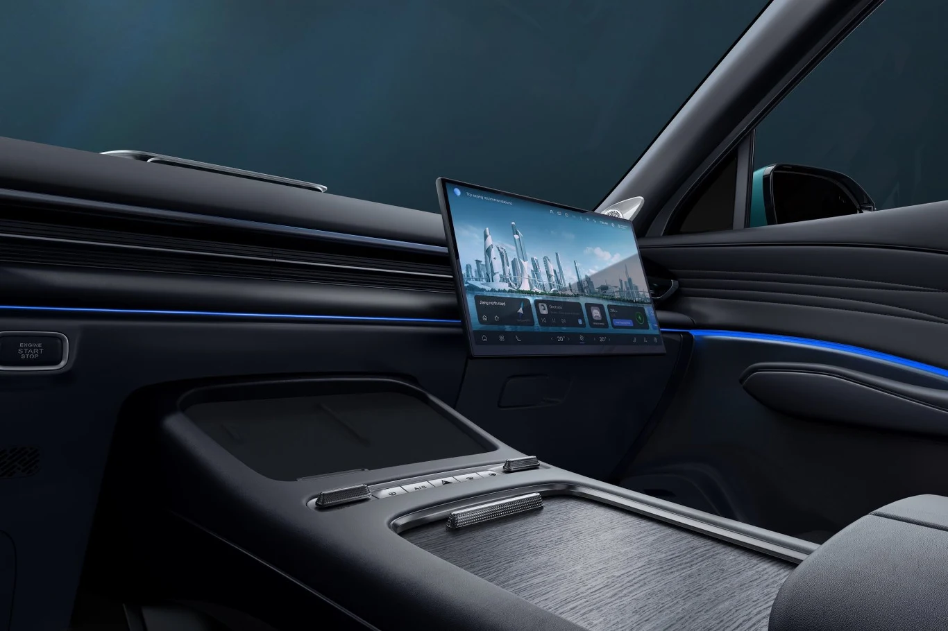 nowoczesne wnętrze samochodu z dużym, centralnie umieszczonym ekranem dotykowym, podświetlone niebieską linią LED, z eleganckim wykończeniem deski rozdzielczej i panelu środkowego