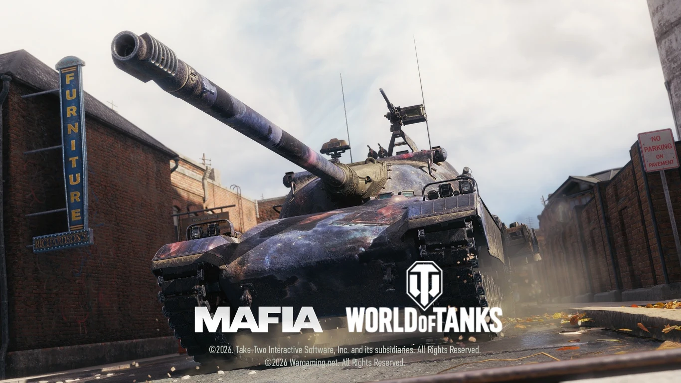 ciężki czołg poruszający się wąską miejską ulicą otoczoną ceglaną zabudową, na pierwszym planie charakterystyczne logotypy gier Mafia oraz World of Tanks, po lewej stronie widoczny pionowy szyld z napisem „Furniture”