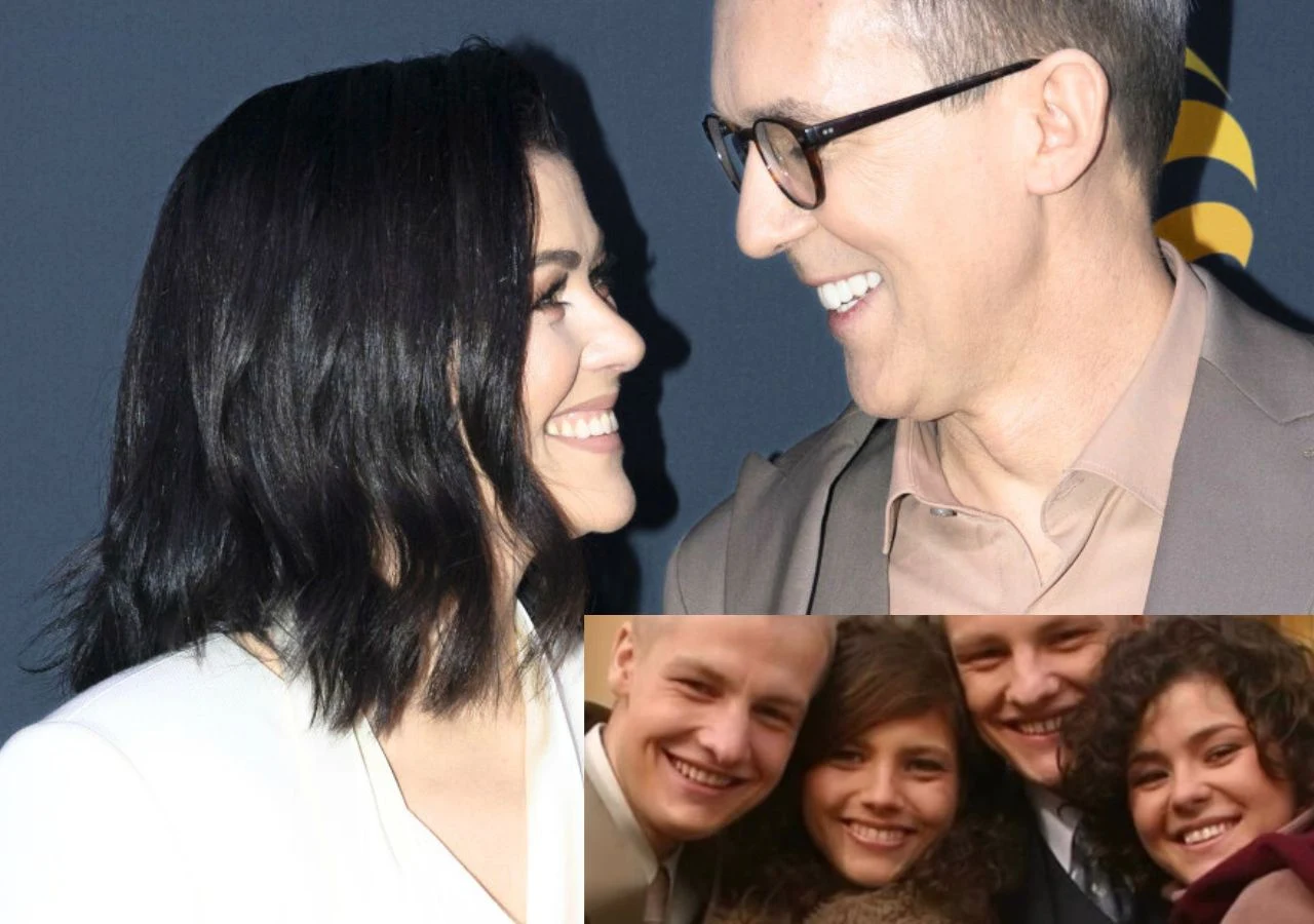 Katarzyna Cichopek na archiwalnym zdjęciu z aktorami "M jak miłość" Para uśmiechających się do siebie osób, kobieta z ciemnymi włosami i mężczyzna w okularach, w eleganckich strojach, na tle ciemnej ściany; w rogu zdjęcia widać grupę trzech uśmiechniętych osób pozujących razem do zdjęcia.