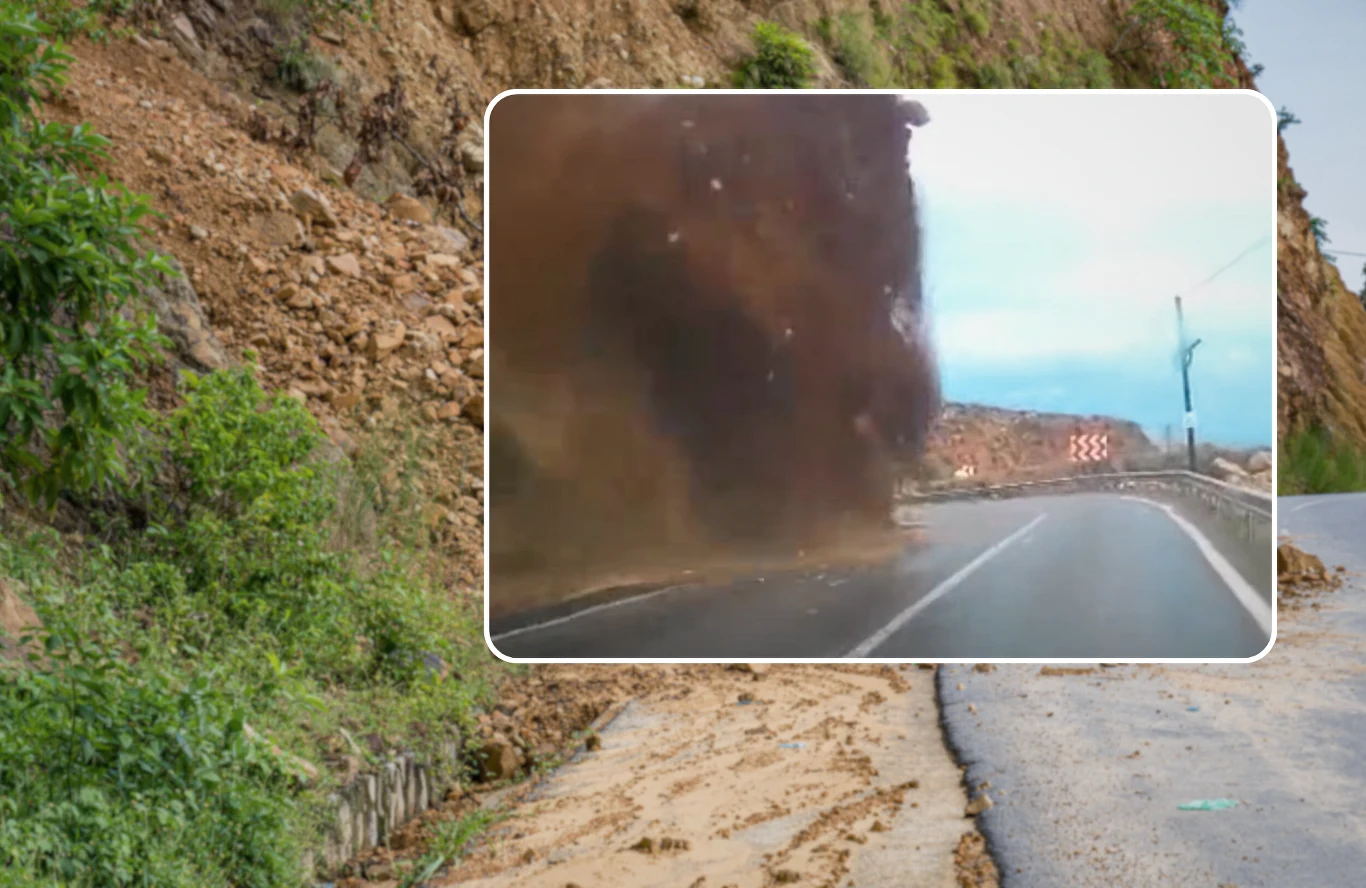 Osuwisko w Turcji pochłonęło auto. Kamerka samochodowa wszystko nagrała. Osuwisko ziemi zasypujące asfaltową drogę w Turcji, widoczne kamienie, wzgórze, znaki ostrzegawcze i barierki.