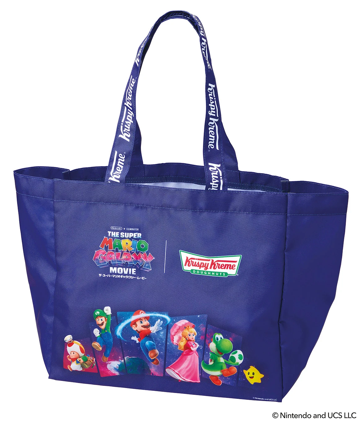 Granatowa torba materiałowa z motywem filmu The Super Mario Bros. Movie oraz logotypem Krispy Kreme; na dole widoczne kolorowe grafiki postaci Mario, Luigi, Peach i Yoshi na niebieskim tle.