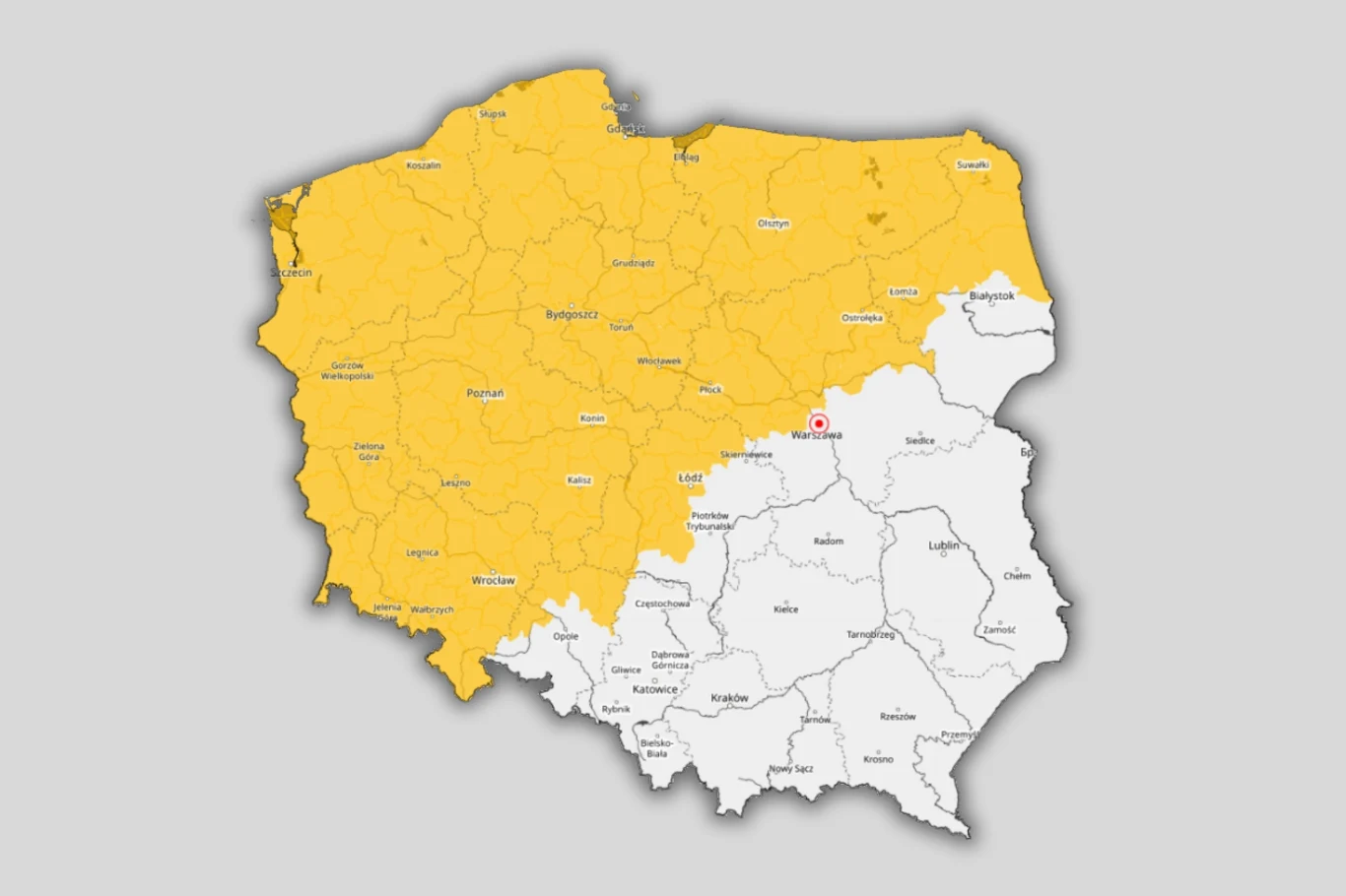 mapa Polski z wyraźnym podziałem na dwie strefy – północno-zachodnia część kraju zaznaczona żółtym kolorem, południowo-wschodnia część w białym kolorze; widoczne granice województw oraz lokalizacja miasta Warszawa oznaczona czerwoną kropką.