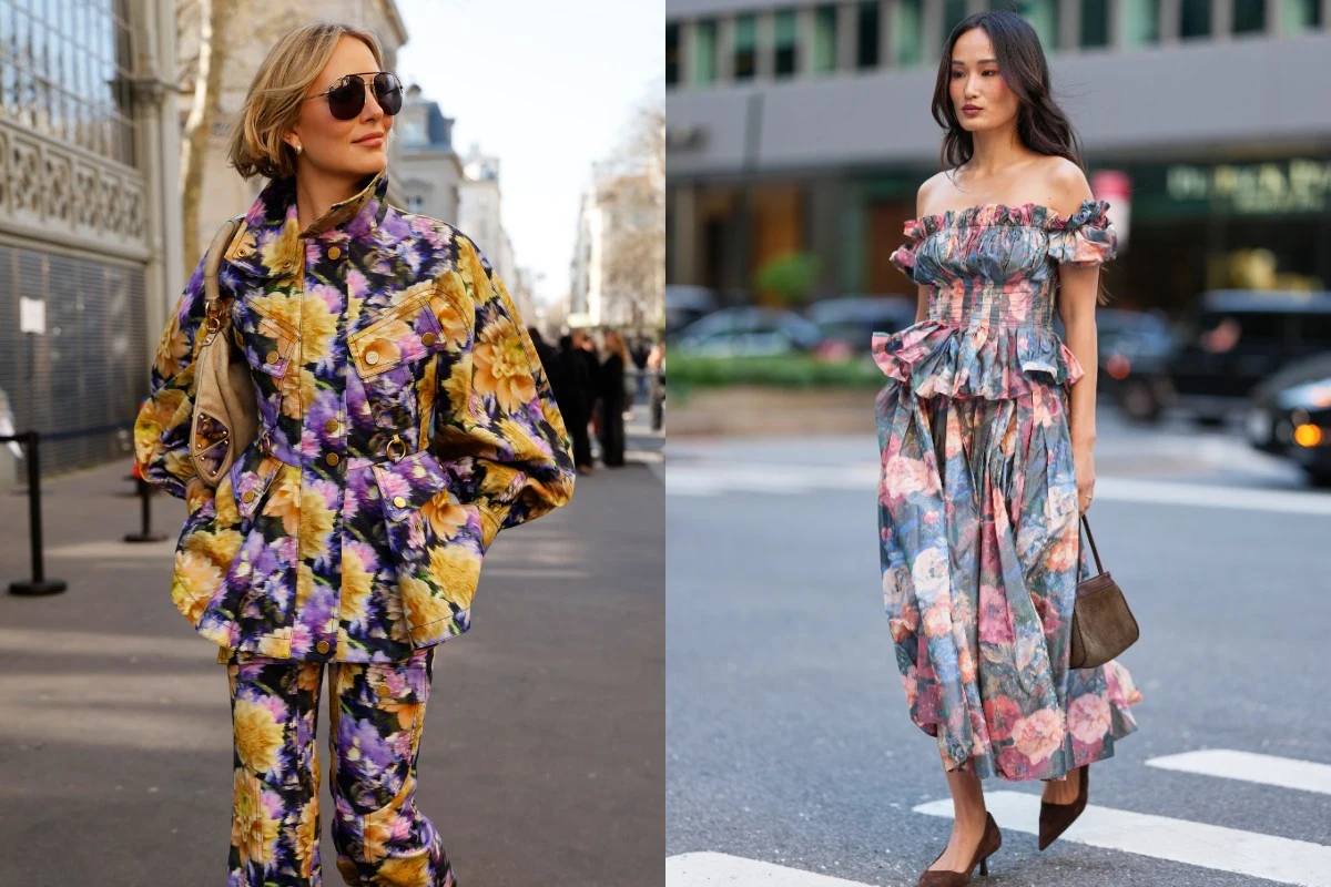 Dwie kobiety ubrane w stroje w kolorowe, kwieciste wzory; po lewej kobieta w żółto-fioletowym komplecie z szeroką kurtką i spodniami, nosząca okulary przeciwsłoneczne, po prawej kobieta w zwiewnej sukience z odkrytymi ramionami i rozkloszowaną spódnicą...