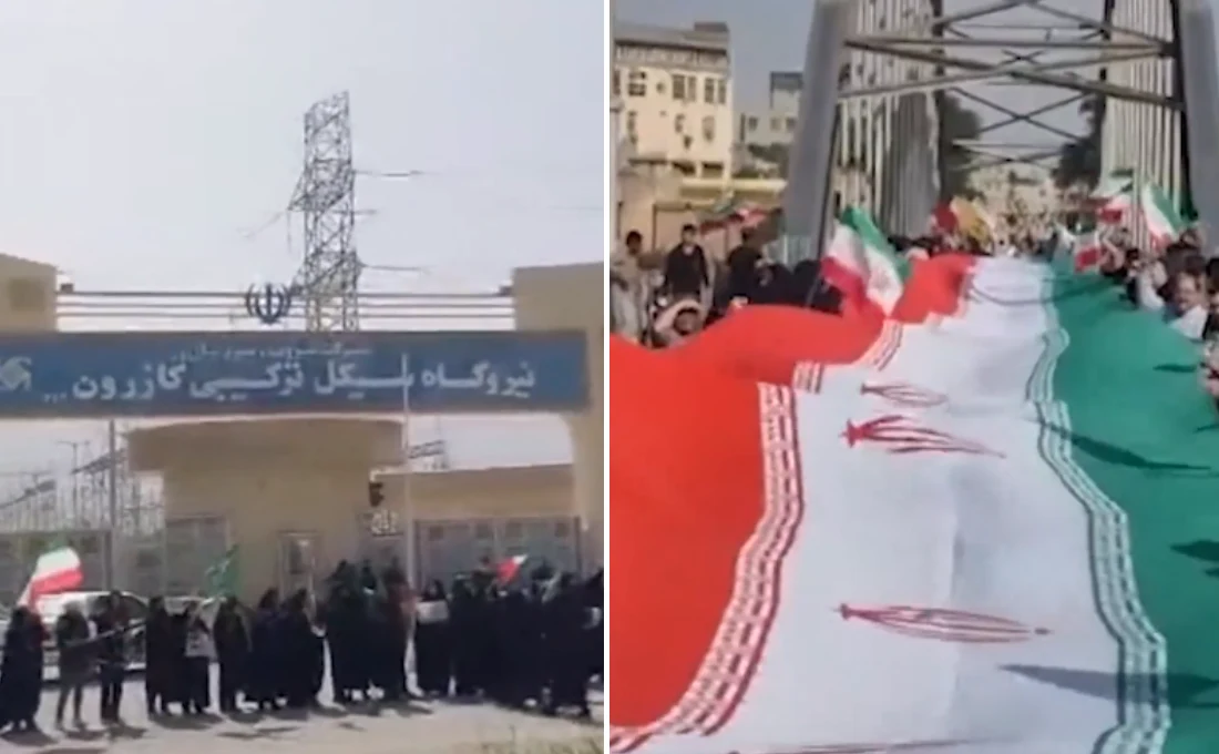 Tłum przed bramą obiektu przemysłowego z napisem po persku oraz osoby z dużą flagą Iranu na moście.