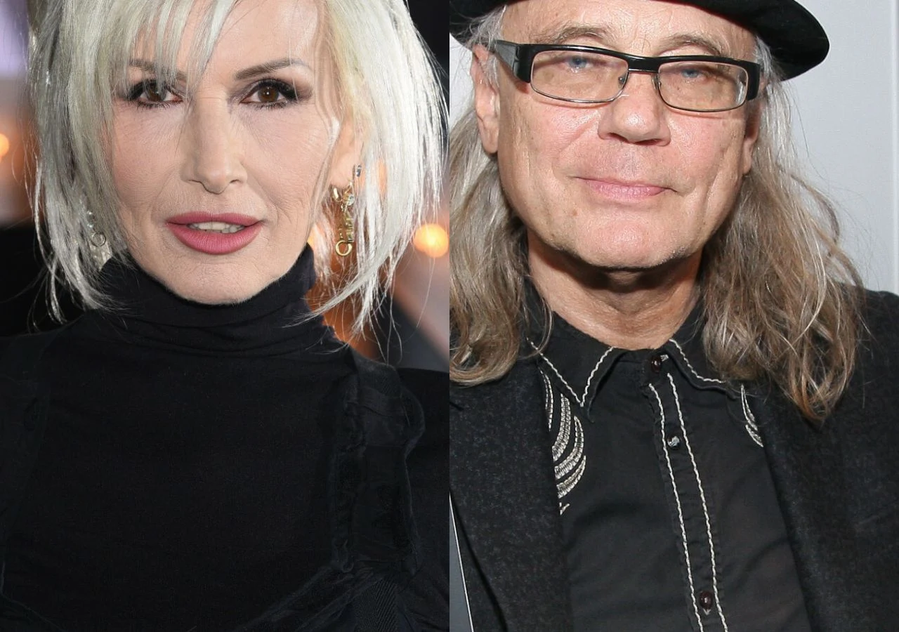 Kora i Kamil Sipowicz Kora i Kamil Sipowicz stoją obok siebie; Kora w jasnych blond włosach i czarnym stroju, Sipowicz w czerni i kapeluszu.