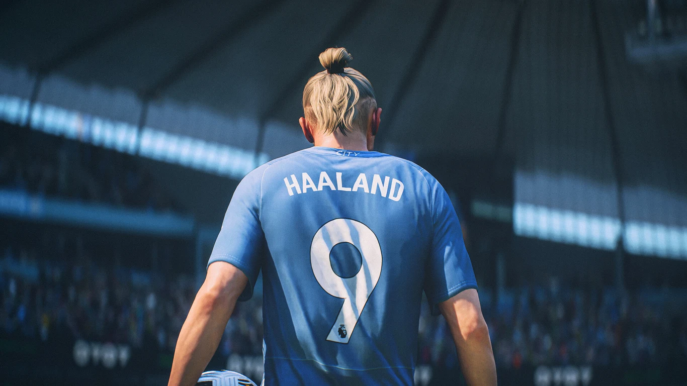 EA Sports FC Piłkarz EA Sports FC w niebieskiej koszulce z numerem 9 i nazwiskiem 'Haaland' na tle stadionu pełnego kibiców