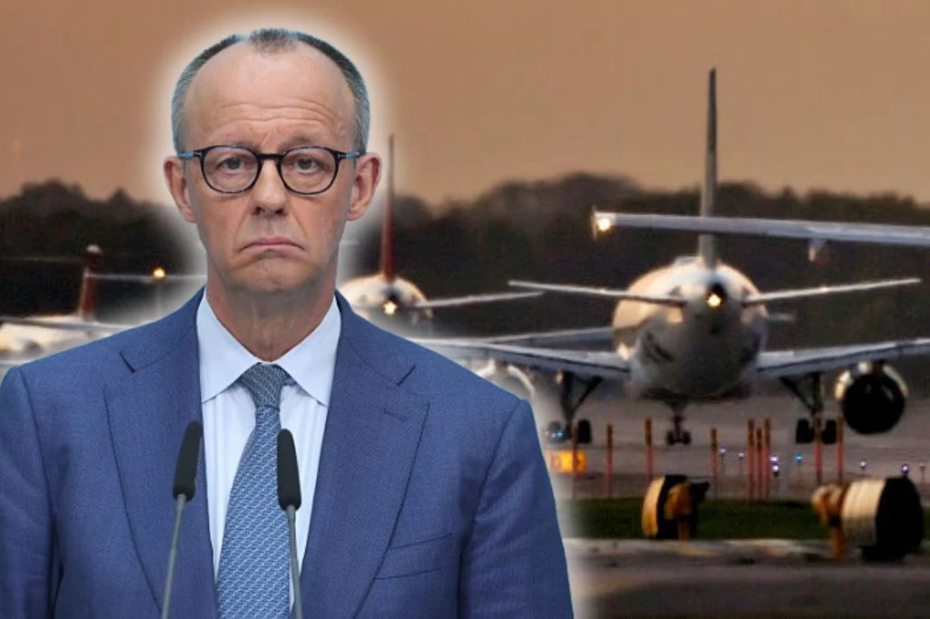 Braki paliwa lotniczego w Europie. Niemcy zwołali pilne posiedzenie Kanclerz Niemiec Friedrich Merz na tle samolotów na płycie lotniska