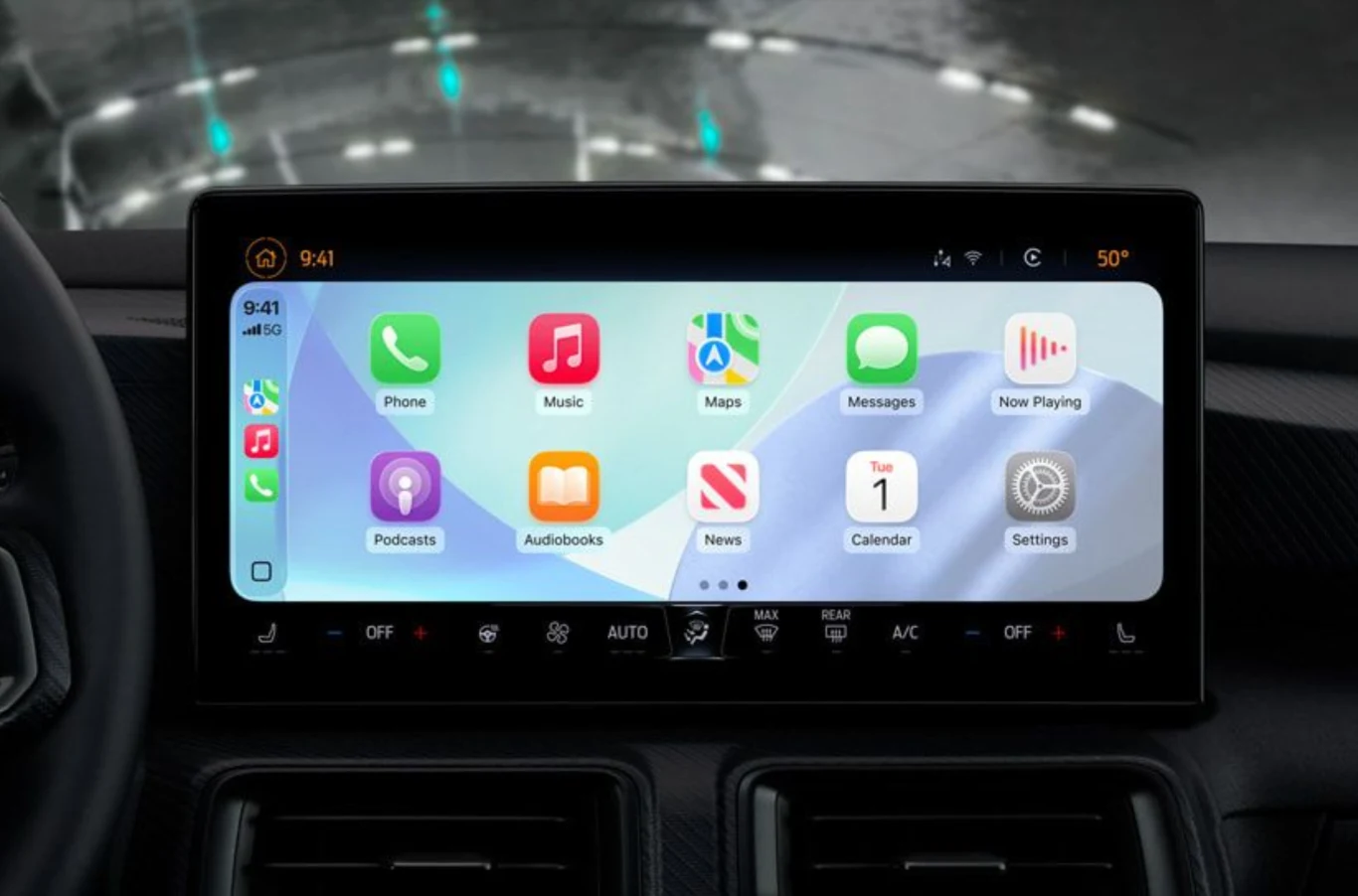 Nowy CarPlay Ultra w Hyundai i Kia. Apple wchodzi do masowych modeli. Duży ekran systemu CarPlay Ultra w aucie Hyundai lub Kia z ikonami aplikacji Apple, panel klimatyzacji poniżej.