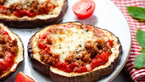 Eggplant Pizza with Tomato Sauce, Minced Meat, Mozzarella and Basil, Mini Pizza over Bright Background