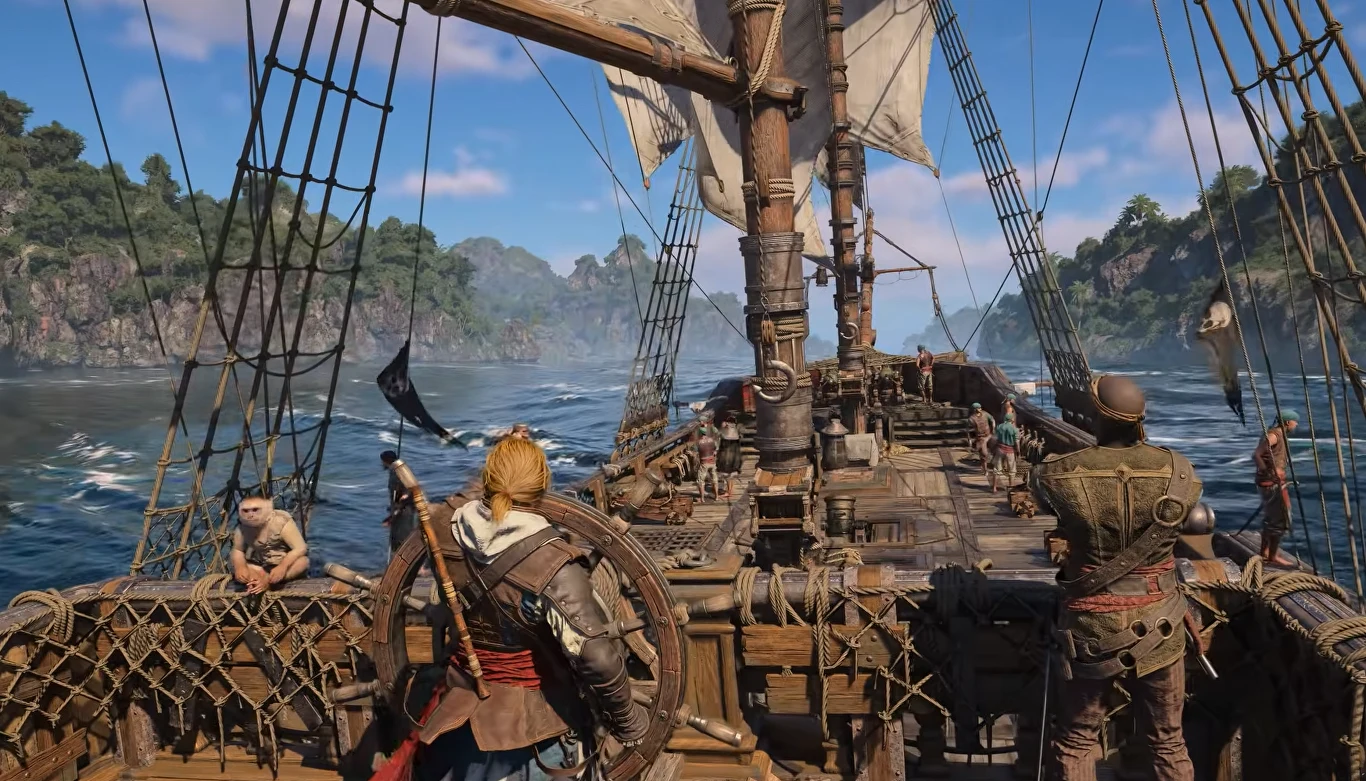 Assassin's Creed Black Flag Resynced Drewniany statek żaglowy Assassin’s Creed Black Flag Resynced płynie po wodach, załoga i osoba za sterem, zielone wzgórza w tle.