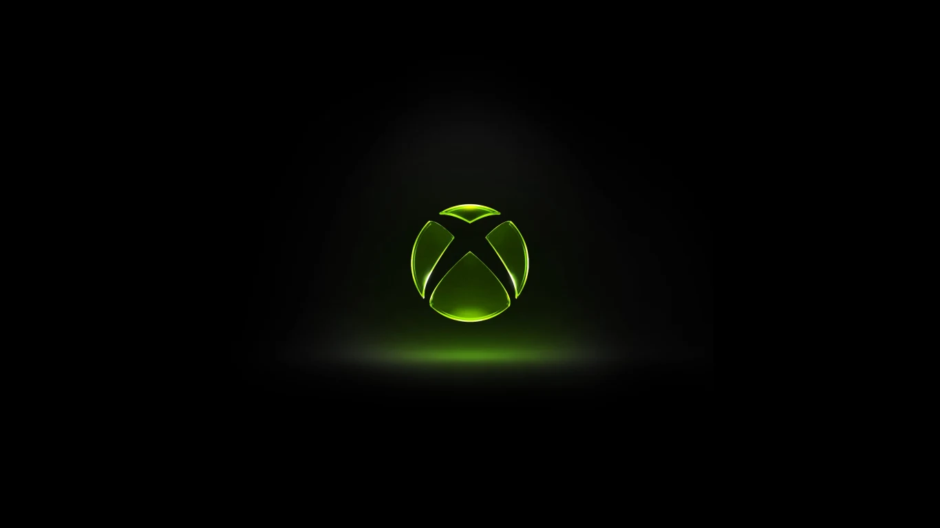 Xbox z nowym logotypem Nowe, jasnozielone logo Xbox wyeksponowane centralnie na czarnym tle z delikatnym blaskiem światła.