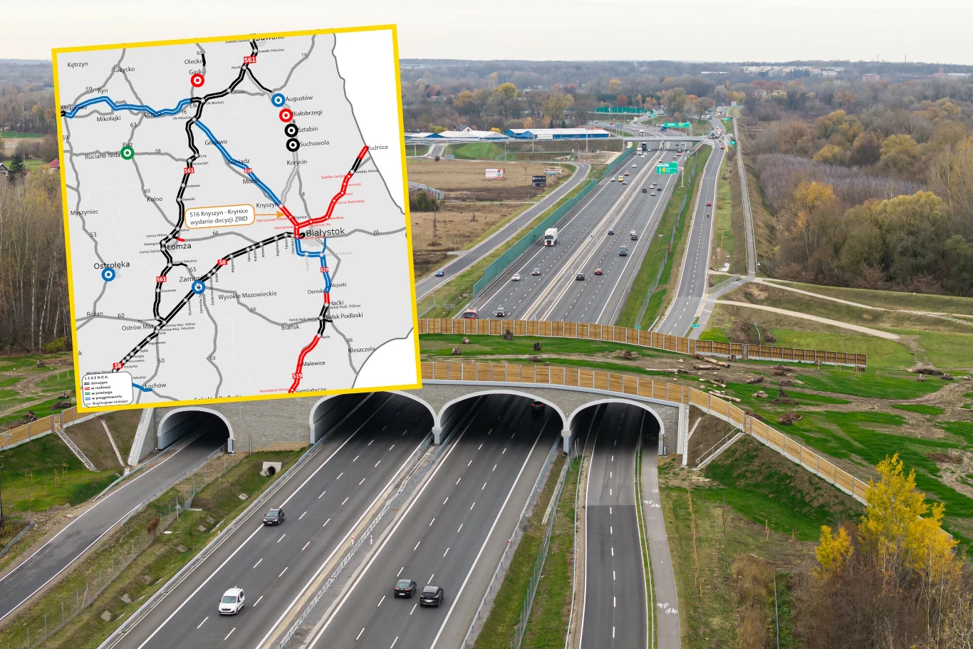 Może ruszać budowa fragmentu drogi S16 / GDDKiA Czteropasmowa droga S16 z zadaszonym przejazdem ekologicznym, w tle tereny zielone i mapa autostrad.