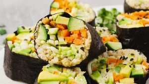 Vegan Sushi Rolls with Fresh Vegetables and Quinoa, Tasty Vegetarian Meal on Bright Background