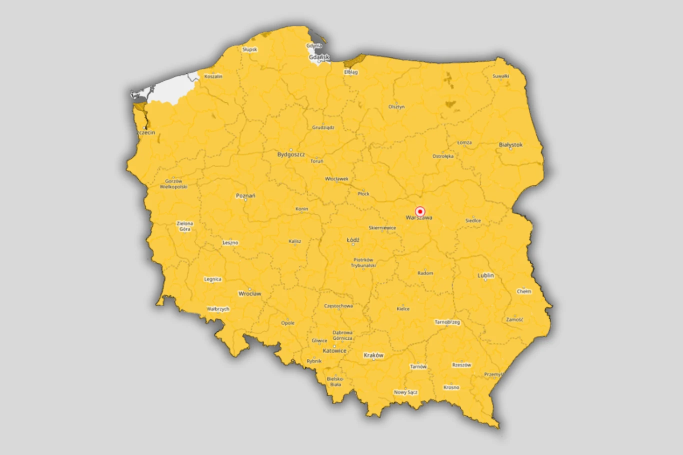 Żółte ostrzeżenia przed przymrozkami obowiązują w prawie wszystkich polskich powiatach mapa Polski z podziałem na województwa, niemal cały obszar oznaczony kolorem żółtym, w centralnej części kraju widoczny czerwony punkt wskazujący Warszawę; na północnym zachodzie niewielki obszar przy granicy zaznaczony na biało