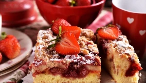 homemade strawberry cake and a cup of coffee on the table in rustic style
