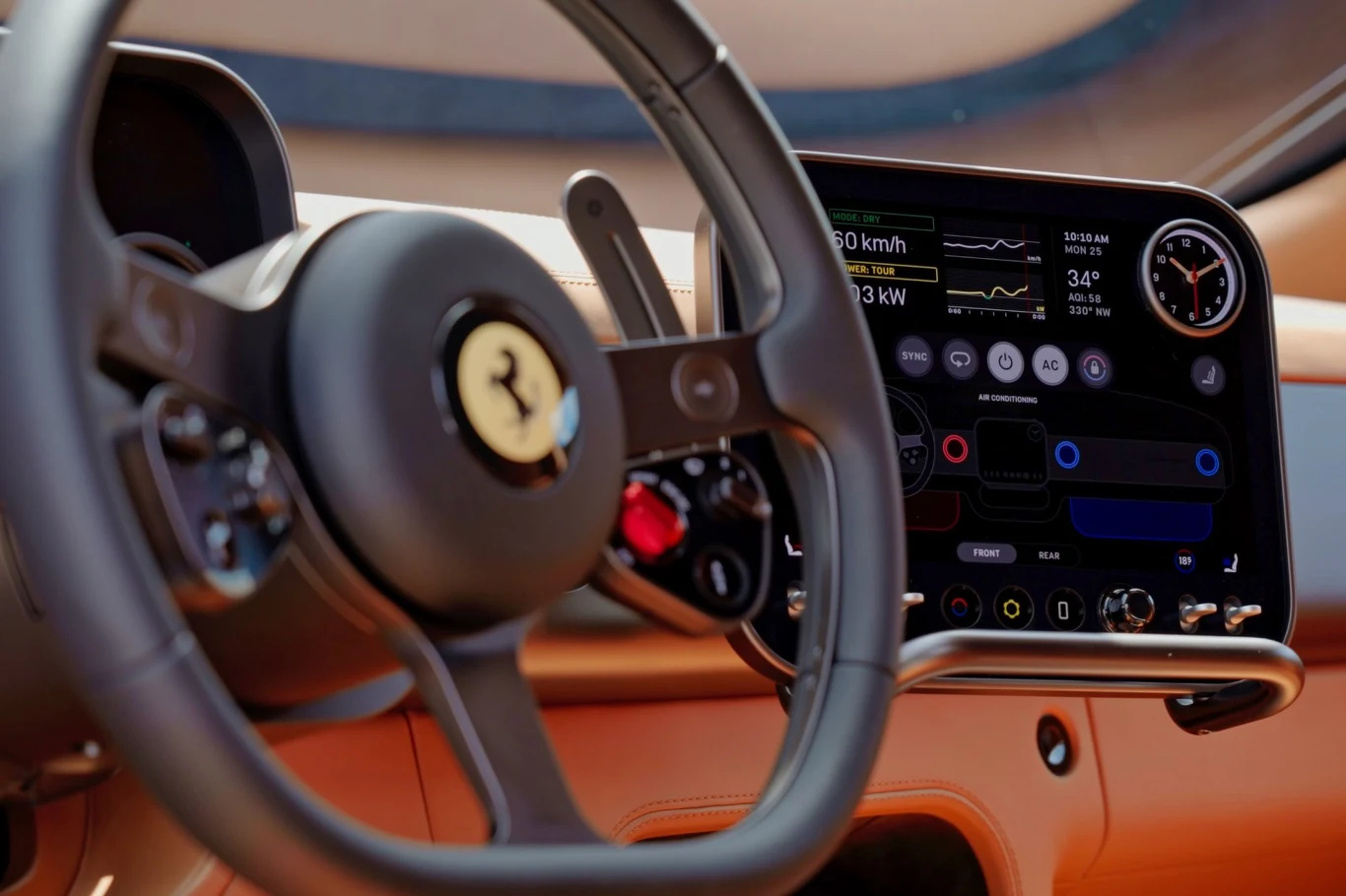 Luksusowa deska rozdzielcza samochodu Ferrari z cyfrowym wyświetlaczem pokazującym prędkość, temperaturę oraz inne parametry pojazdu, obok eleganckiej kierownicy z charakterystycznym logo marki.