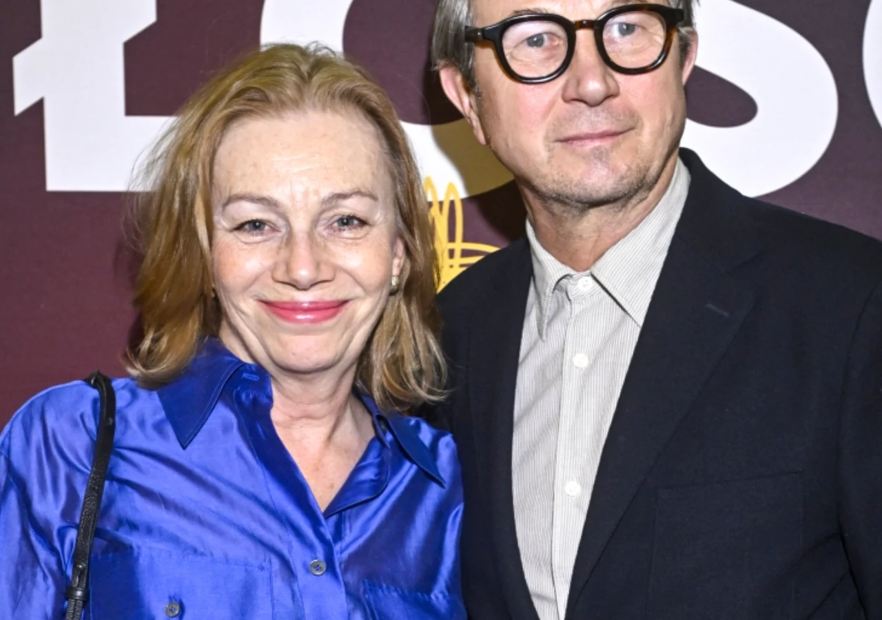 Maja Barełkowska i Piotr Cyrwus Uśmiechnięci Maja Barełkowska i Piotr Cyrwus pozują razem na ściance. Para aktorów w eleganckich strojach.