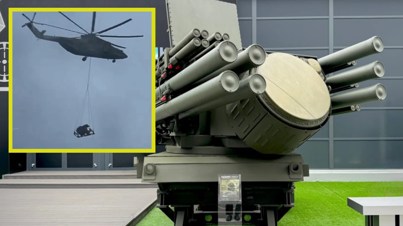 Rosjanie montują systemy przeciwlotnicze Pancyr-SMD na wieżowcach. To w obawie przed atakami ukraińskich dronów. Śmigłowiec transportowy montuje system przeciwlotniczy Pancyr-SMD na dachu wieżowca w Moskwie, obok wyrzutnia Pancyr-SMD na wystawie.