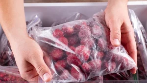Frozen strawberries. Frozen berries and fruits in a plastic bag in freezer
