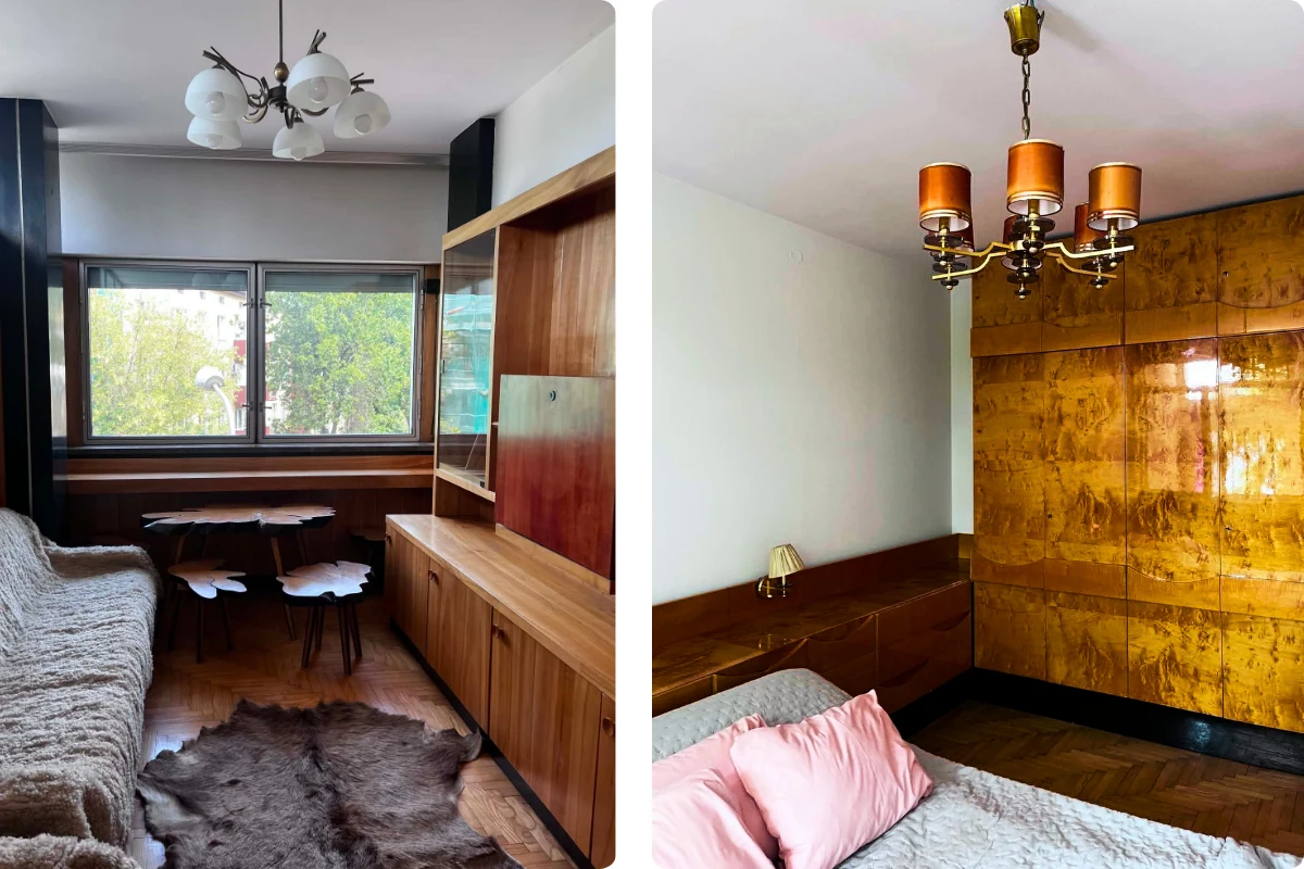 Wnętrza umeblowane w stylu PRL z drewnianymi meblościankami, klasycznymi żyrandolami i dużymi oknami, w salonie sofa z narzutą i charakterystycznym stolikiem, w sypialni łóżko z różowymi poduszkami oraz szafa z połyskującym fornirem.