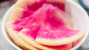 close up view of fresh watermelon radish slices in bowl