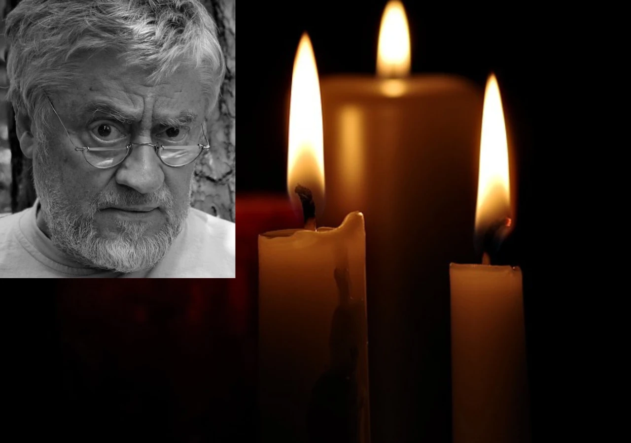 Nie żyje Janusz Michałowski Twarz starszego mężczyzny z brodą i okularami zestawiona z trzema palącymi się świecami na ciemnym tle.