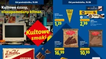 Reklama z kultowymi słodyczami – czekolady i wafle marki E. Wedel, batoniki, retro monitor komputerowy z klawiaturą, hasła promujące sentymentalny klimat lat minionych oraz wyeksponowane ceny produktów na niebieskim tle.