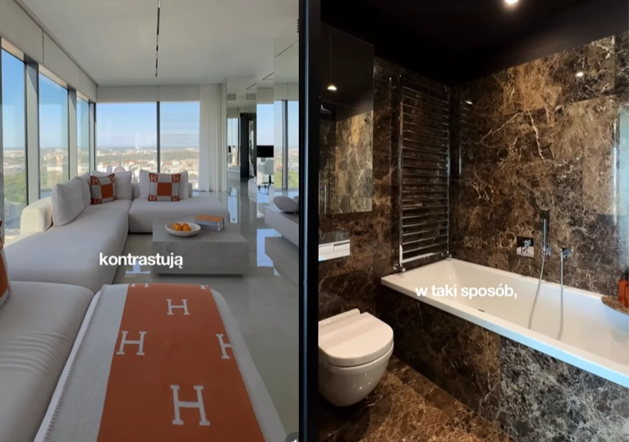 Wnętrza apartamentu na sprzedaż Julii Von Stein Jasny salon z dużymi oknami, białymi meblami i pomarańczowymi akcentami po lewej stronie oraz łazienka z ciemnymi marmurowymi ścianami, wanną i toaletą po prawej stronie.