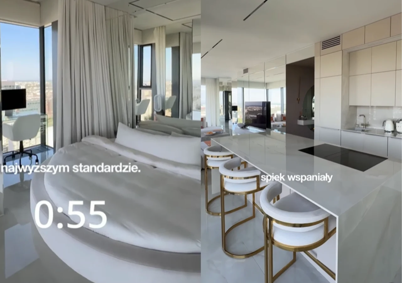 Wnętrza apartamentu na sprzedaż Julii Von Stein Nowoczesna sypialnia z dużym okrągłym łóżkiem oraz kuchnia z białą wyspą i eleganckimi, złotymi hokerami, całość utrzymana w jasnej kolorystyce z panoramicznymi oknami oferującymi widok na miasto.