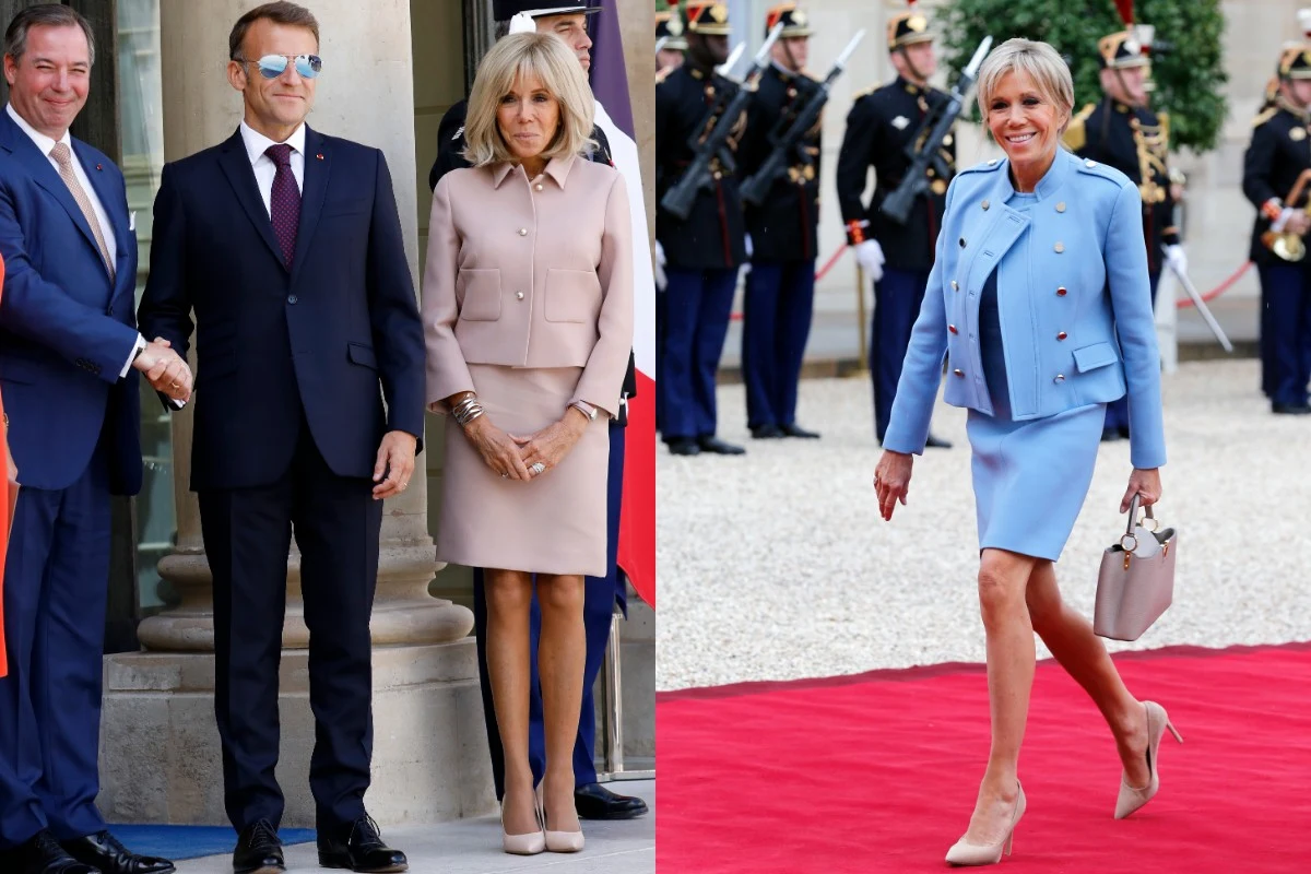 Elegancko ubrana kobieta w klasycznych, pastelowych kostiumach, stojąca obok mężczyzny w garniturze oraz krocząca z uśmiechem po czerwonym dywanie, w tle żołnierze w mundurach paradnych.