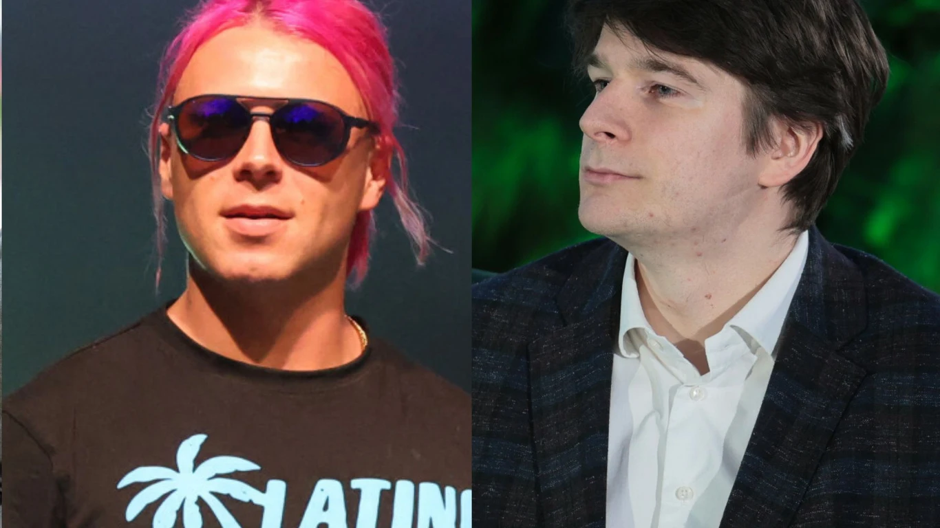 Skolim i Daniel Nawrocki Daniel Nawrocki w koszuli i marynarce oraz Skolim w okularach przeciwsłonecznych.