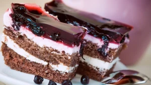 Slice of blueberry pie with yoghurt