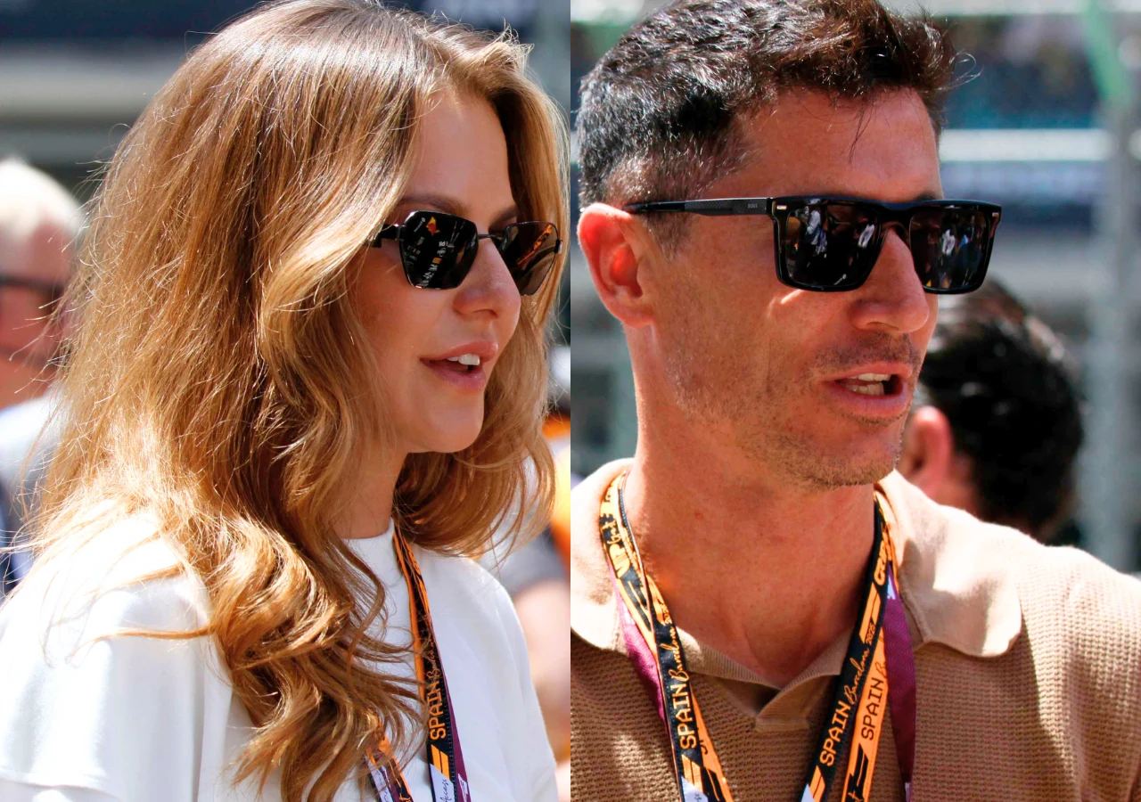 Anna Lewandowska, Robert Lewandowski Dwie osoby w okularach przeciwsłonecznych, każda z nich nosi białą koszulkę i zawieszki na szyi z kolorowym napisem GRAND PRIX, stoją obok siebie w słonecznej scenerii.