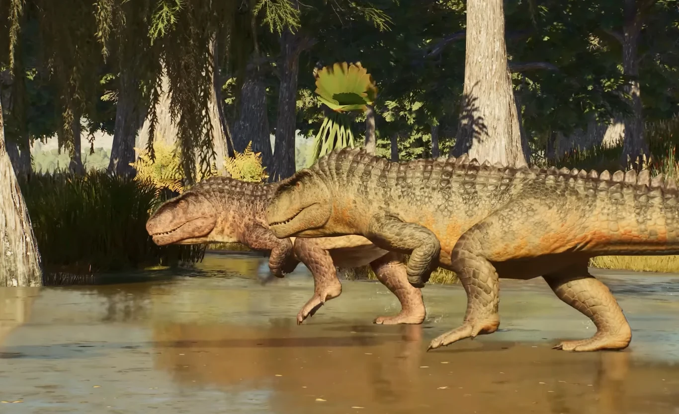 Jurassic World Evolution 3 Dwa duże dinozaury przechodzą przez płytką wodę w lesistym, prehistorycznym otoczeniu w Jurassic World Evolution 3.