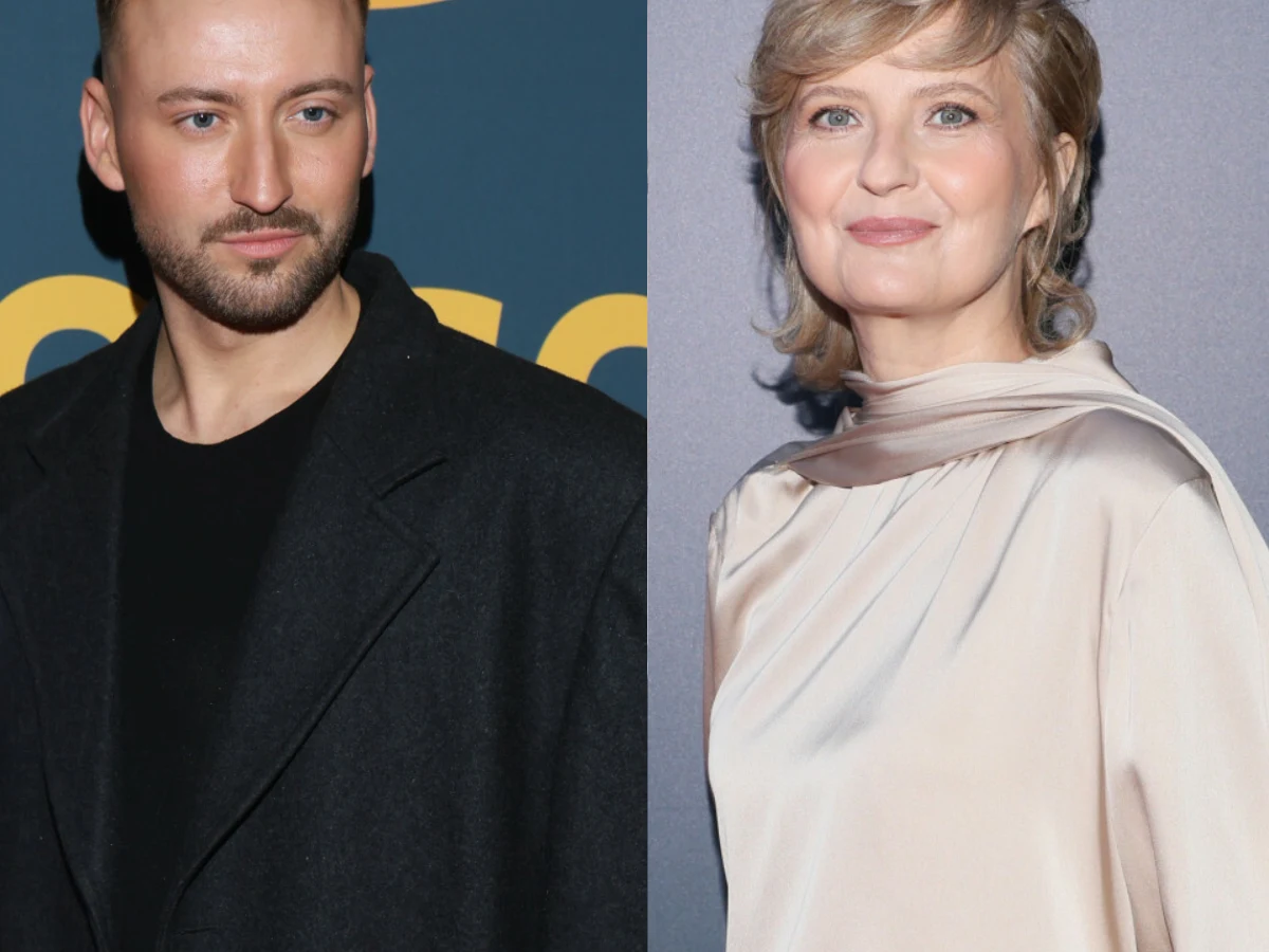 Michał Bartkiewicz i Izabela Kuna Dwie osoby pozujące na tle dekoracyjnych ścian, mężczyzna w czarnym płaszczu i kobieta w eleganckiej, jasnej sukni z satynowym połyskiem.