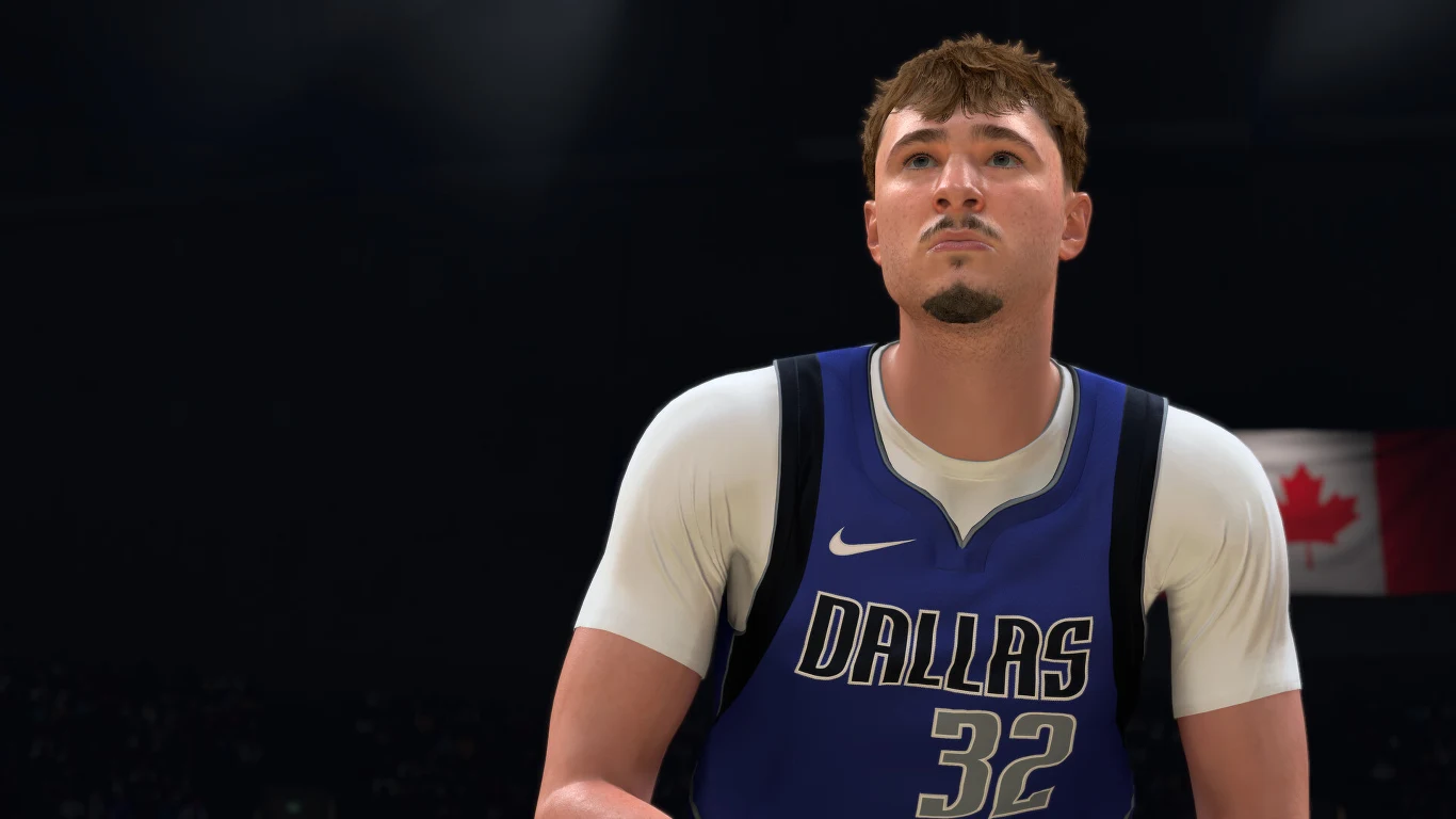 NBA 2K27 Koszykarz Dallas z numerem 32 w granatowej koszulce podczas meczu, w tle flaga Kanady, NBA 2K27.