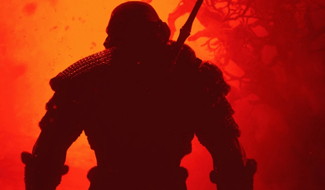 Wiedźmin 3 x Diablo 4 Sylwetka wojownika w zbroi z mieczem na plecach na tle czerwonego, zamglonego światła.