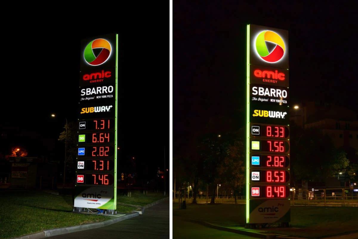 Pylon stacji paliw Amic Energy z podświetlanym logo, nazwami fast foodów Sbarro i Subway oraz wyświetlanymi cenami paliw ON, 95, LPG i innych, sfotografowany zarówno w nocy, jak i o zmierzchu.