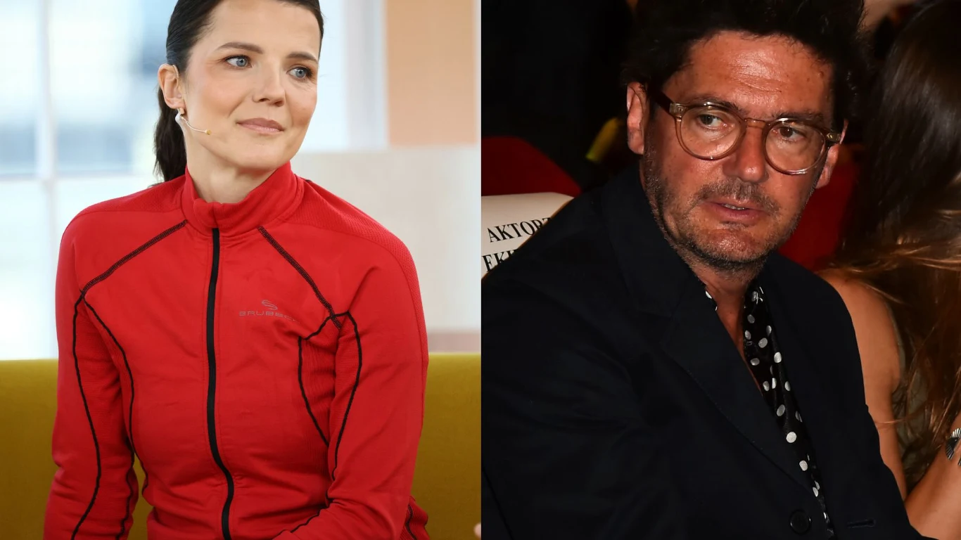Joanna Jabłczyńska i Kuba Wojewódzki Joanna Jabłczyńska w czerwonej bluzie oraz Kuba Wojewódzki w ciemnej marynarce siedzący na sofie.